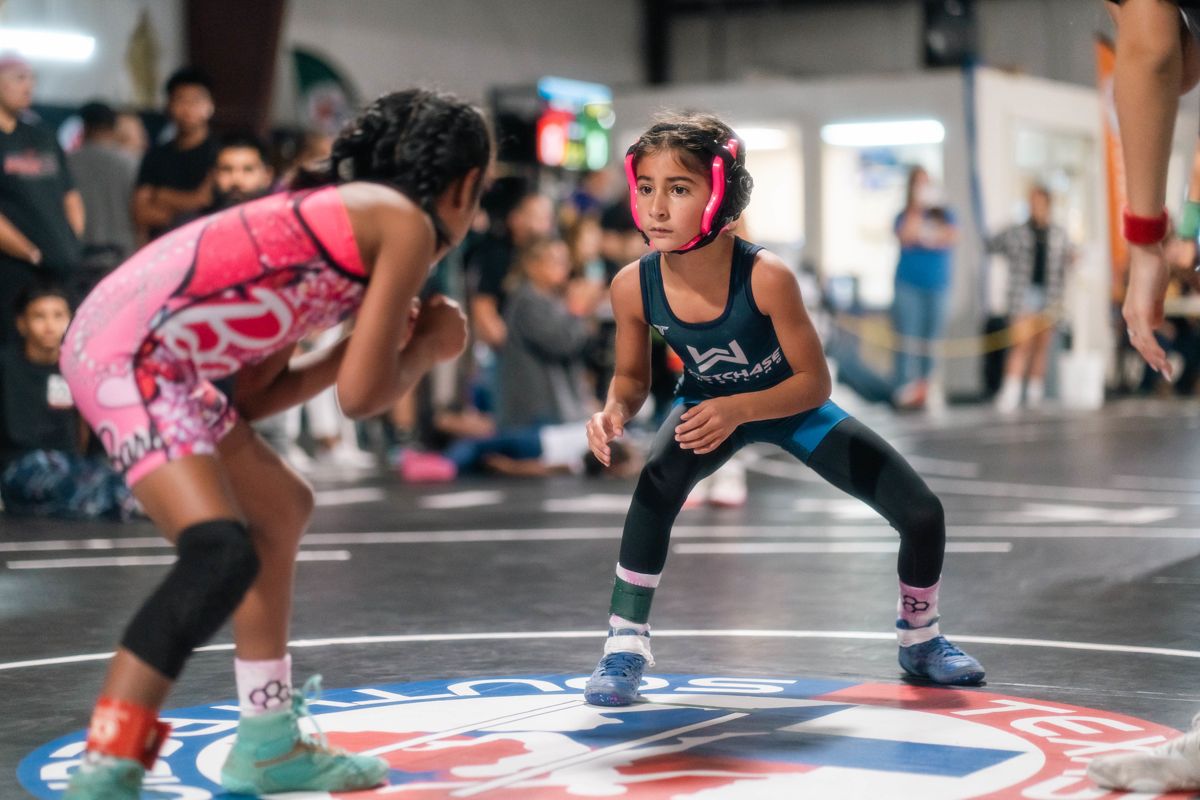 Young girl wrestlers competing