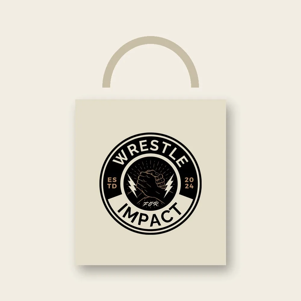 Cream canvas tote bag printed with the Wrestle for Impact logo